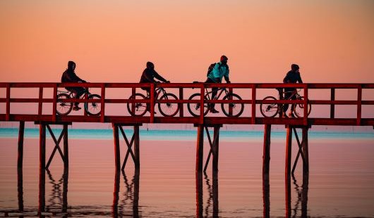 Four cyclists getting outside for sunrise at the Trapiche in Pelotas, Brazil